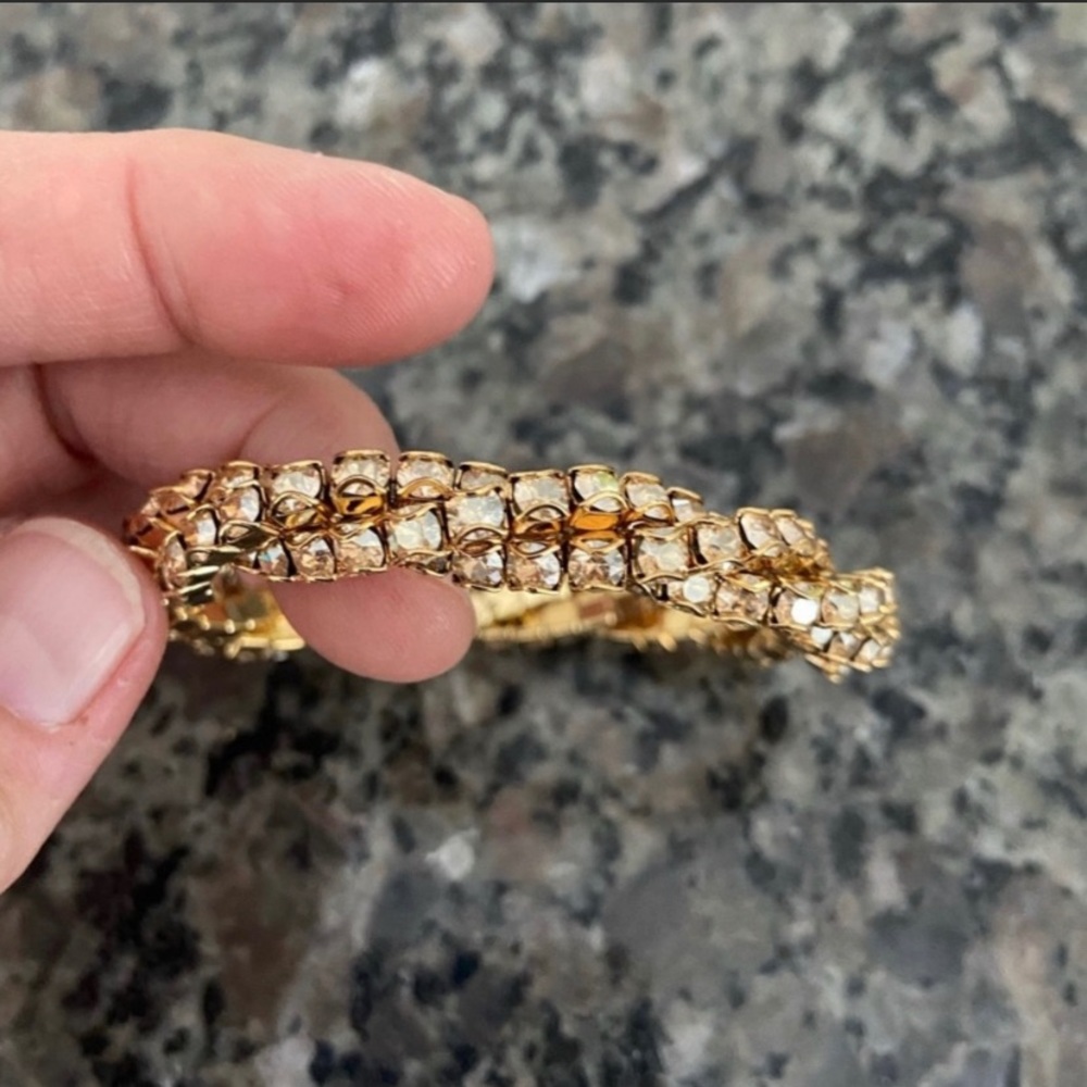 Sparkly gold bracelet.  No clasp.  Slides over wrist.  Great bridesmaid gift.